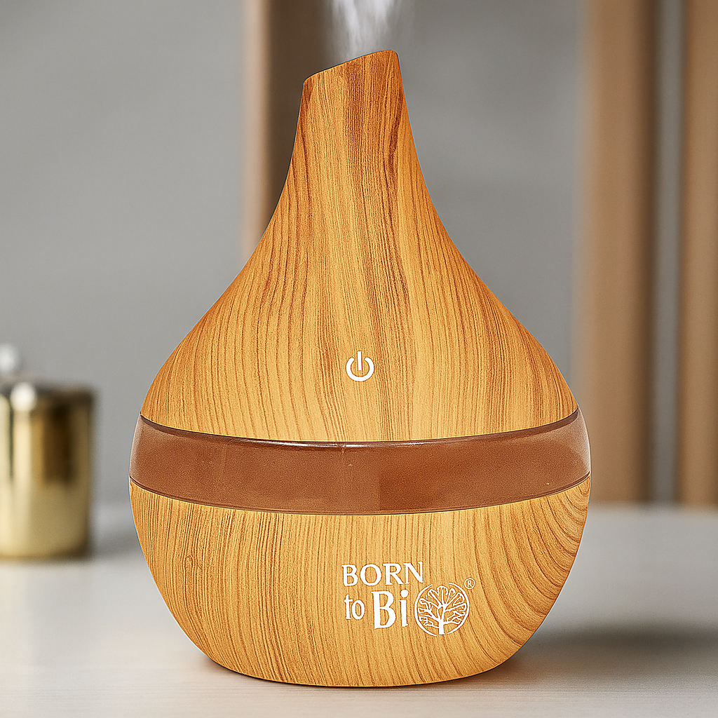 Idées cadeaux pour femme : diffuseur d'huiles essentielles bois clair en fonctionnement, idéal pour une ambiance zen et naturelle à la maison